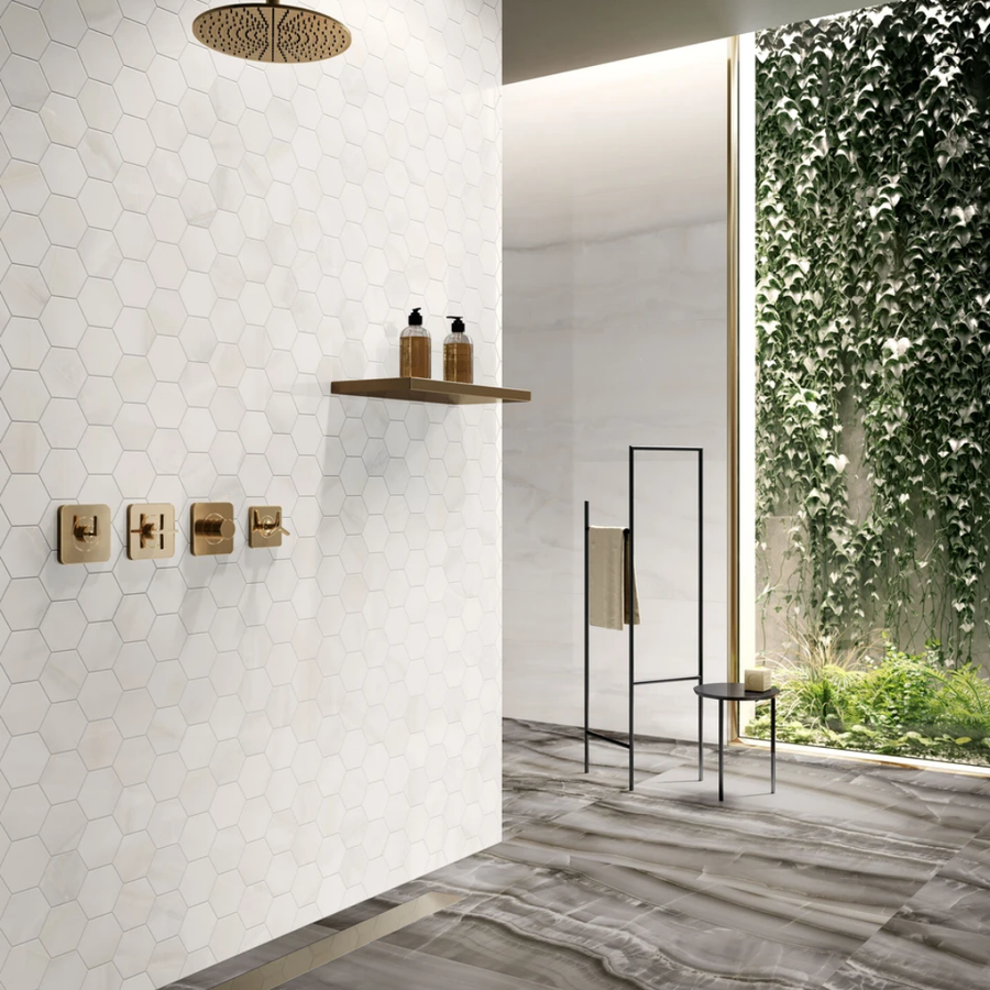 Bathroom wall and floor with white marble effect porcelain tiles