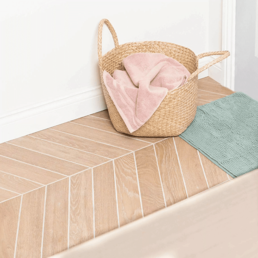 Brown porcelain tiles featuring chevron wood effect design