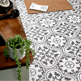 Patterned black ceramic tiles featuring stylish monochrome artwork