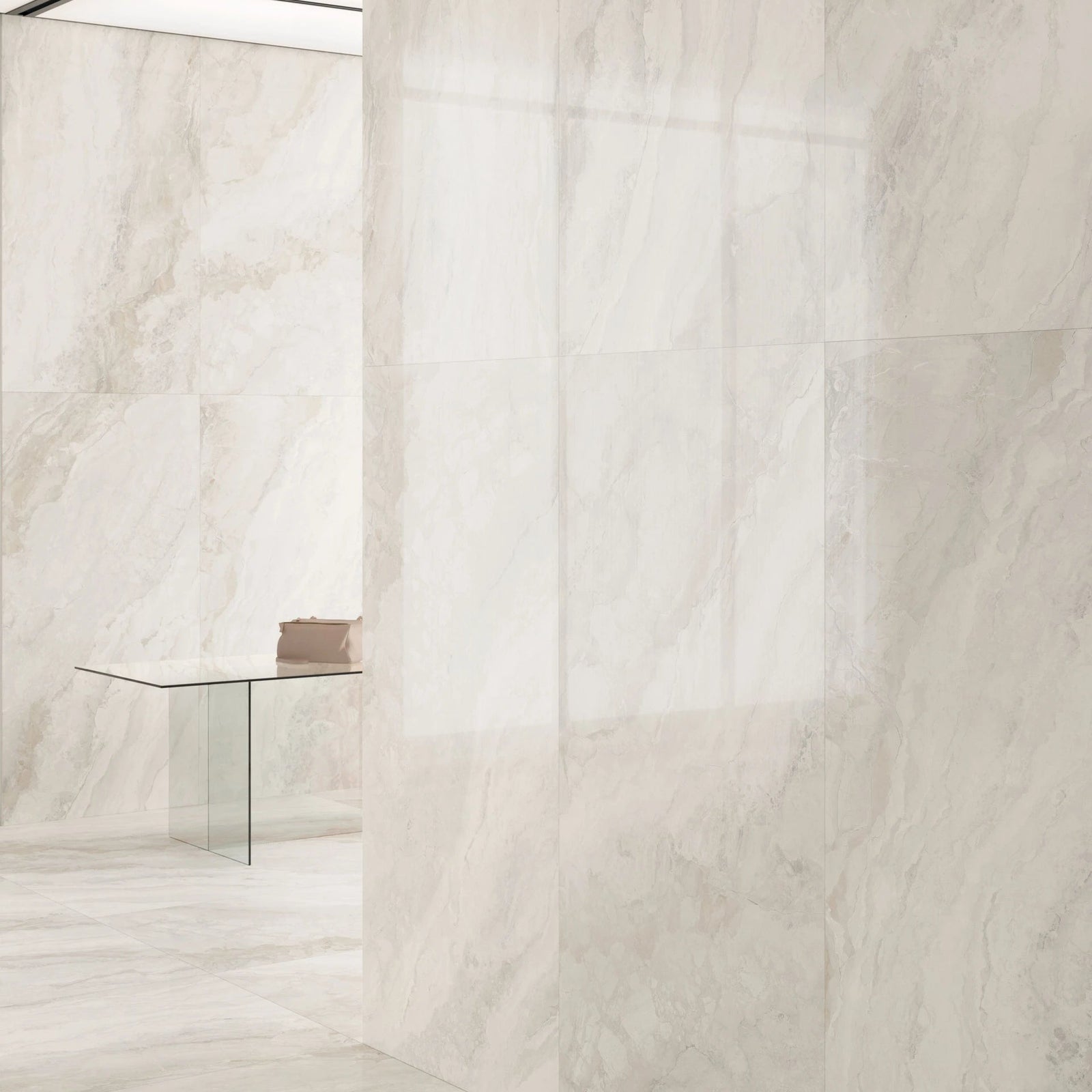 Light beige marble tiles with a subtle pattern on a white background