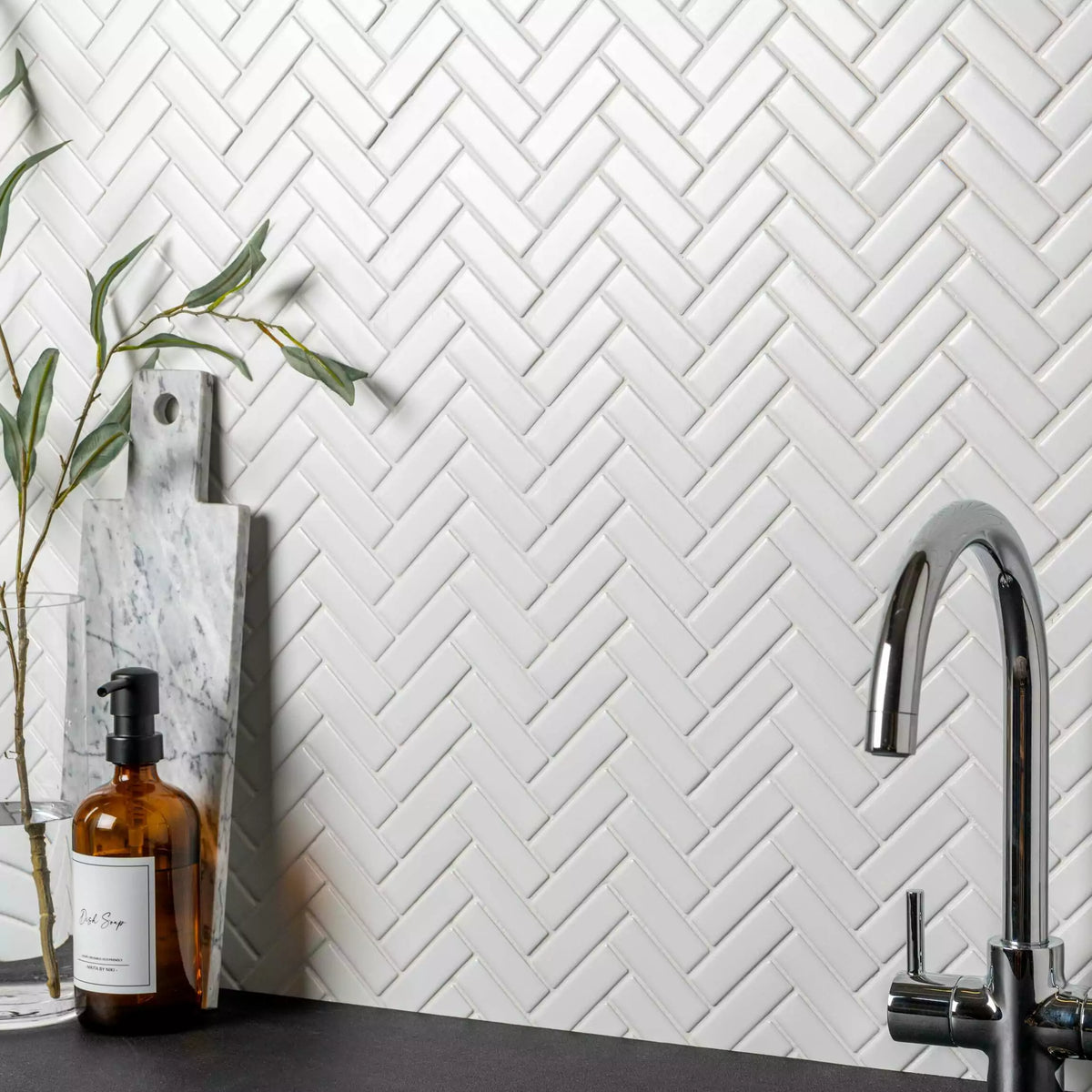 Elegant white herringbone mosaic wall and floor tiles