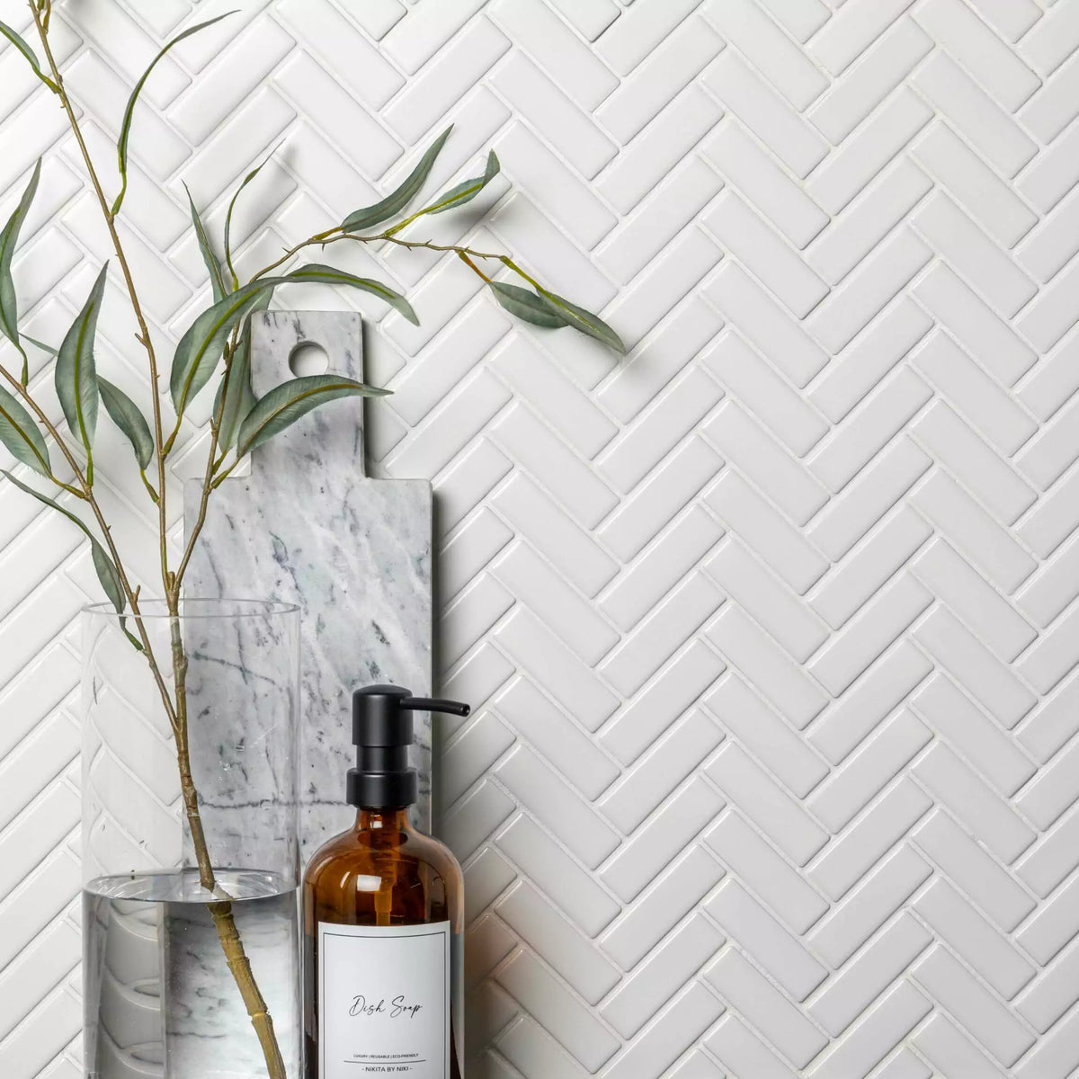 White porcelain herringbone mosaic wall and floor tiles