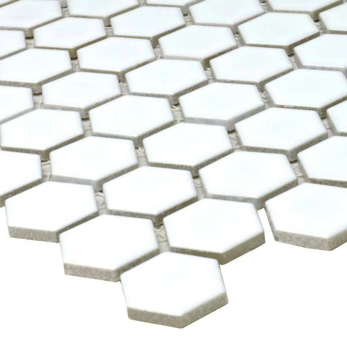 Polished white hexagon mosaic tiles on interior walls