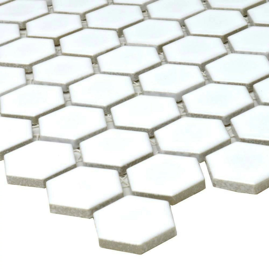 Polished white hexagon mosaic tiles on interior walls