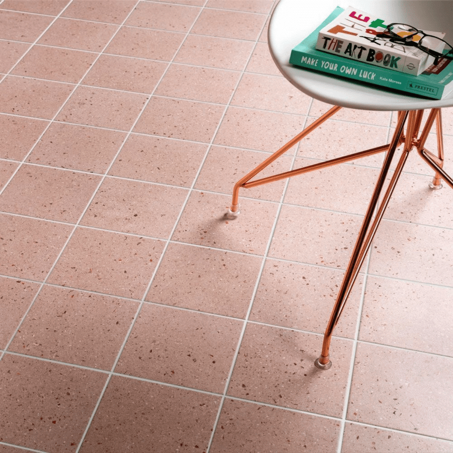 Pink terrazzo effect porcelain tiles featuring subtle speckled pattern