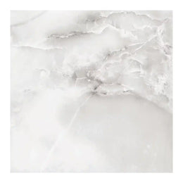 Close-up of Butan Marfil tile showing polished surface and marfil veining