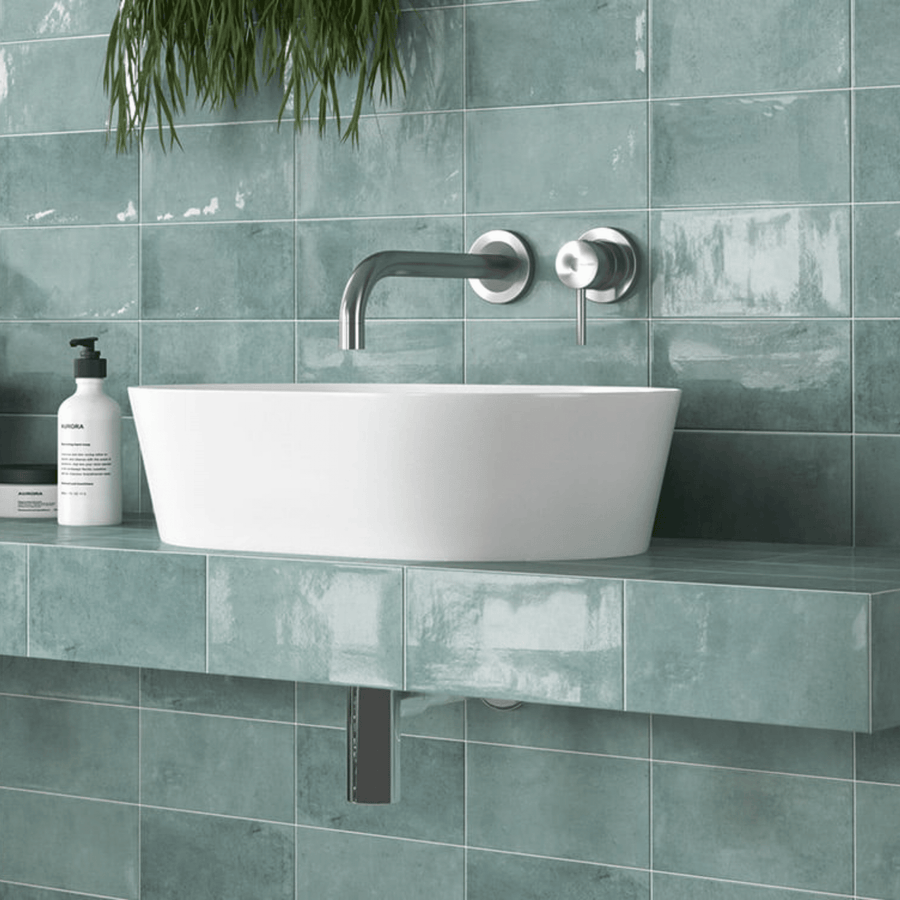 Close-up of Chiswick Emerald tile's vibrant color and glossy finish