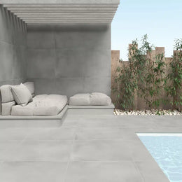 Luxury wall and floor tile in glossy blue finish under natural light